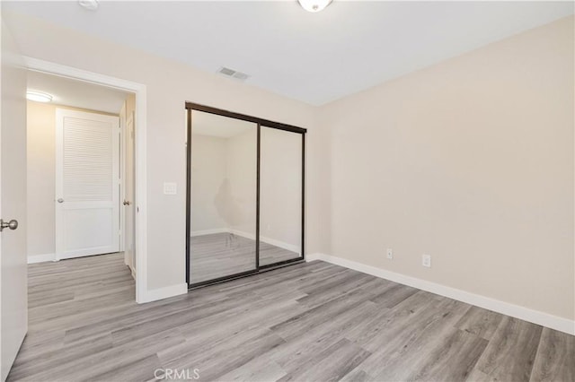 27505 Ventura Dr, Cathedral City, CA 92234 - unfurnished bedroom featuring light wood-style floors, baseboards, and a closet
