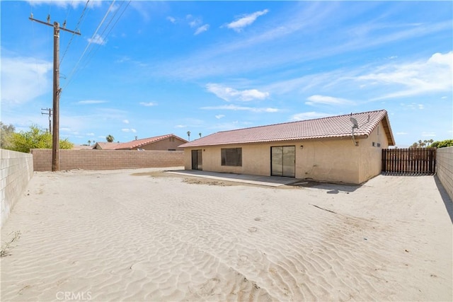 27505 Ventura Dr, Cathedral City, CA 92234 - rear view of property with stucco siding, a tiled roof, and a fenced backyard