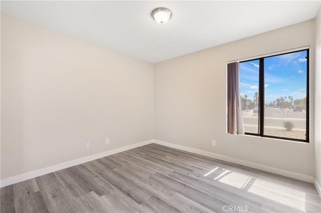 27505 Ventura Dr, Cathedral City, CA 92234 - spare room featuring wood finished floors and baseboards