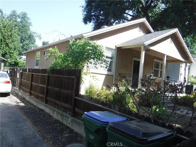 480 E 3rd St, Chico, CA 95928 - view of home's exterior featuring stucco siding and a porch