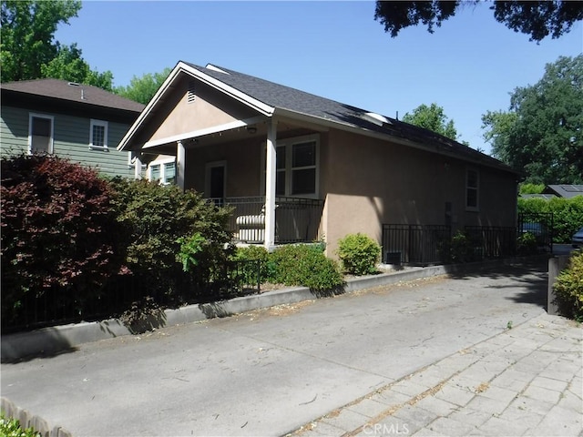 480 E 3rd St, Chico, CA 95928 - view of side of property featuring stucco siding