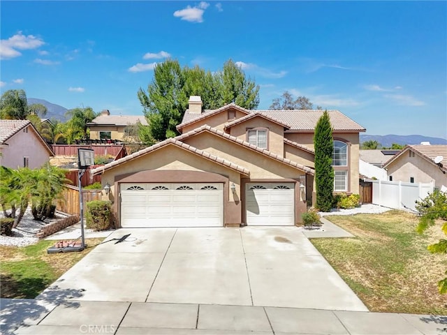 3506 Belvedere Way, Corona, CA 92882 - view of front facade featuring stucco siding, a garage, a tile roof, and a mountain view