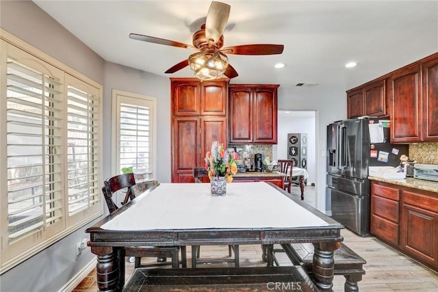 3506 Belvedere Way, Corona, CA 92882 - kitchen with stainless steel refrigerator with ice dispenser, reddish brown cabinets, a ceiling fan, and recessed lighting