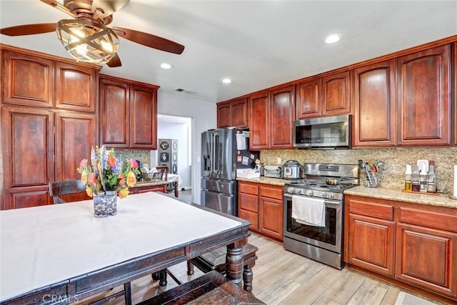3506 Belvedere Way, Corona, CA 92882 - kitchen with stainless steel appliances, ceiling fan, decorative backsplash, light wood-style floors, and recessed lighting