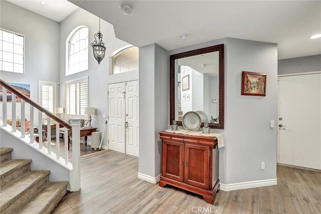 3506 Belvedere Way, Corona, CA 92882 - entryway featuring stairs, light wood-type flooring, recessed lighting, and arched walkways