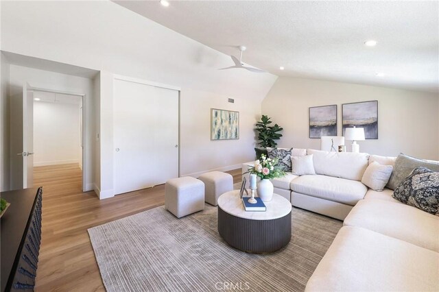 13621 Fairmont Way, Tustin, CA 92780 - living room with lofted ceiling, recessed lighting, ceiling fan, light wood-style flooring, and baseboards