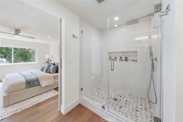 13621 Fairmont Way, Tustin, CA 92780 - ensuite bathroom featuring wood finished floors, a stall shower, ceiling fan, recessed lighting, and baseboards