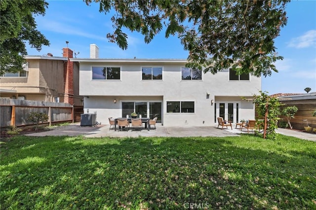 13621 Fairmont Way, Tustin, CA 92780 - rear view of house featuring stucco siding, central AC unit, french doors, a chimney, and a patio area