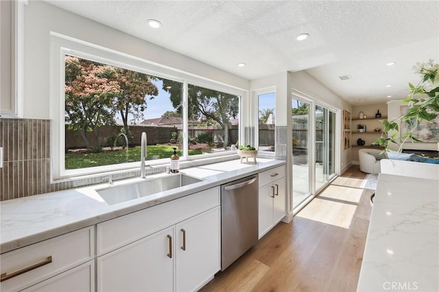 13621 Fairmont Way, Tustin, CA 92780 - kitchen with dishwasher, a sink, light wood-style flooring, white cabinets, and a textured ceiling