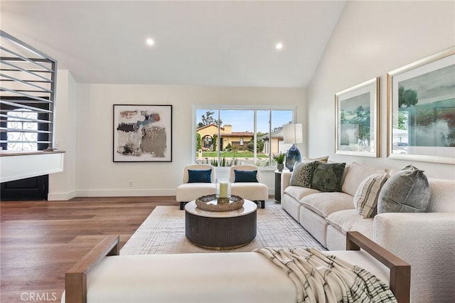 13621 Fairmont Way, Tustin, CA 92780 - living area featuring wood finished floors, recessed lighting, baseboards, and high vaulted ceiling