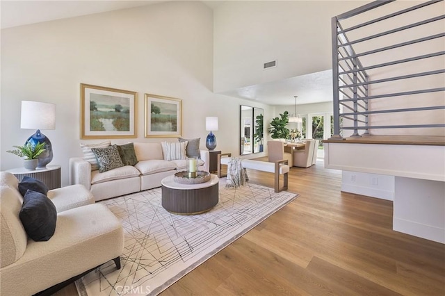 13621 Fairmont Way, Tustin, CA 92780 - living area with wood finished floors, baseboards, and a towering ceiling
