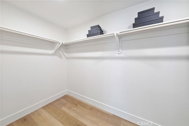 13621 Fairmont Way, Tustin, CA 92780 - walk in closet with light wood-style floors