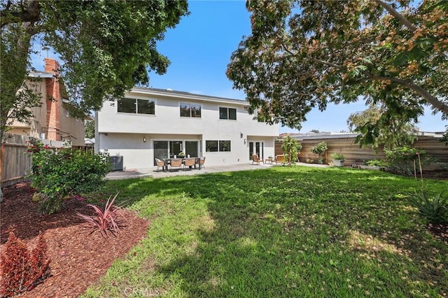 13621 Fairmont Way, Tustin, CA 92780 - back of property featuring stucco siding, cooling unit, a patio, and french doors