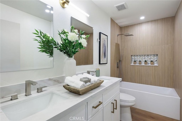 13621 Fairmont Way, Tustin, CA 92780 - full bath with double vanity, toilet, bathtub / shower combination, wood finished floors, and recessed lighting