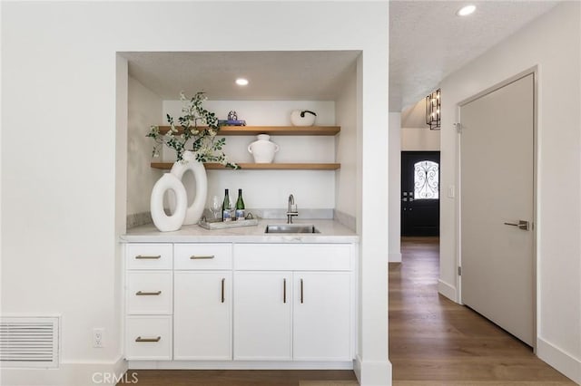 13621 Fairmont Way, Tustin, CA 92780 - indoor wet bar with light wood-style flooring, recessed lighting, and baseboards