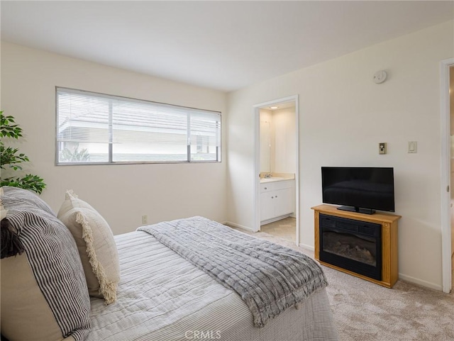 22652 Nadine Cir Unit A, Torrance, CA 90505 - bedroom featuring light carpet, a sink, baseboards, and connected bathroom