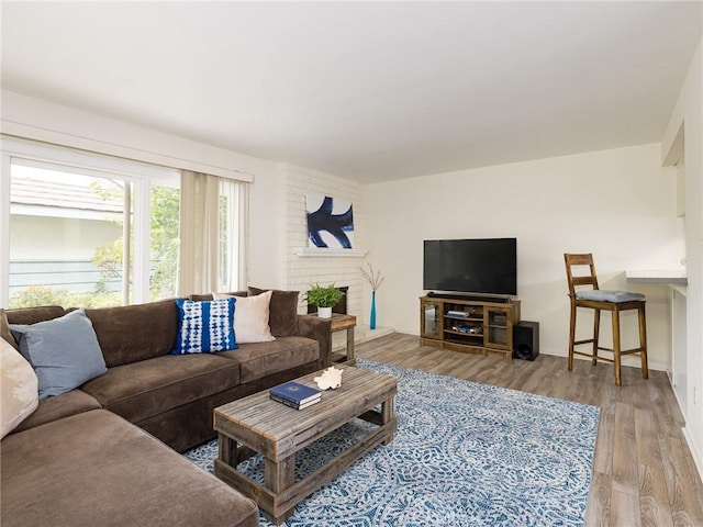 22652 Nadine Cir Unit A, Torrance, CA 90505 - living area with wood finished floors, a fireplace, and baseboards
