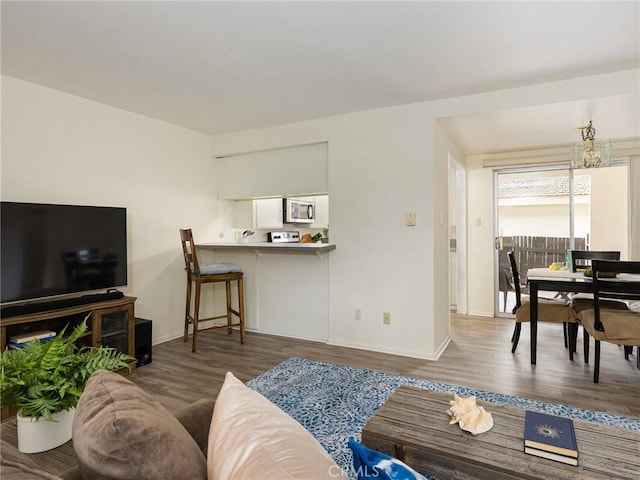 22652 Nadine Cir Unit A, Torrance, CA 90505 - living area with baseboards, wood finished floors, and a chandelier