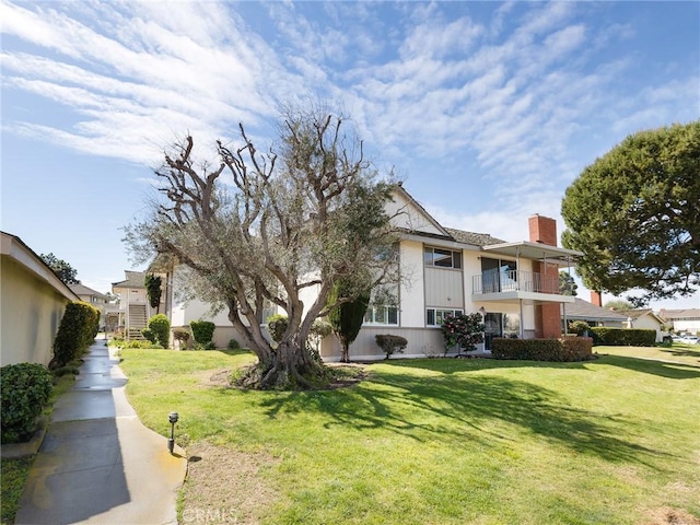 22652 Nadine Cir Unit A, Torrance, CA 90505 - view of front of home with a chimney, a front yard, and a balcony