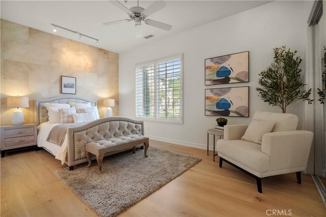 12165 Ojeda Ct, Tustin, CA 92782 - bedroom with track lighting, baseboards, wood finished floors, and a ceiling fan