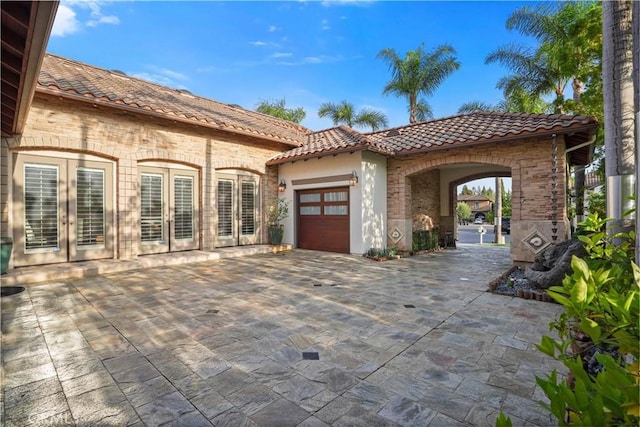 12165 Ojeda Ct, Tustin, CA 92782 - view of patio with french doors and an attached garage