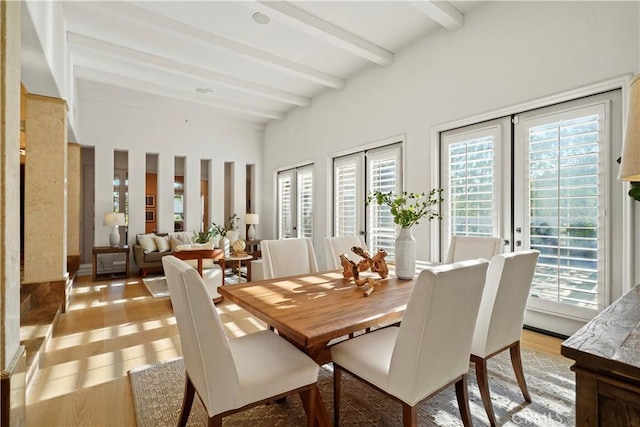 12165 Ojeda Ct, Tustin, CA 92782 - dining area featuring beamed ceiling, plenty of natural light, light wood-type flooring, and french doors