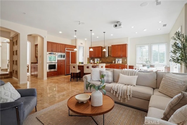 12165 Ojeda Ct, Tustin, CA 92782 - living room with arched walkways and recessed lighting