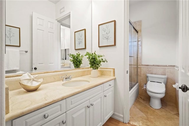 12165 Ojeda Ct, Tustin, CA 92782 - bathroom with vanity, toilet, bath / shower combo with glass door, and tile patterned flooring