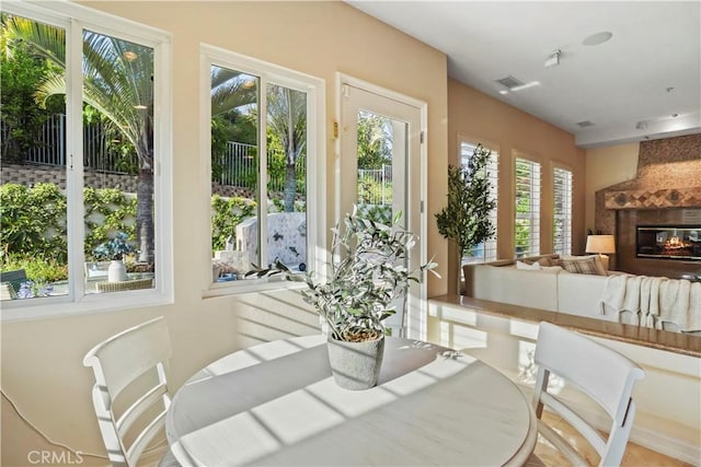 12165 Ojeda Ct, Tustin, CA 92782 - dining space with a glass covered fireplace