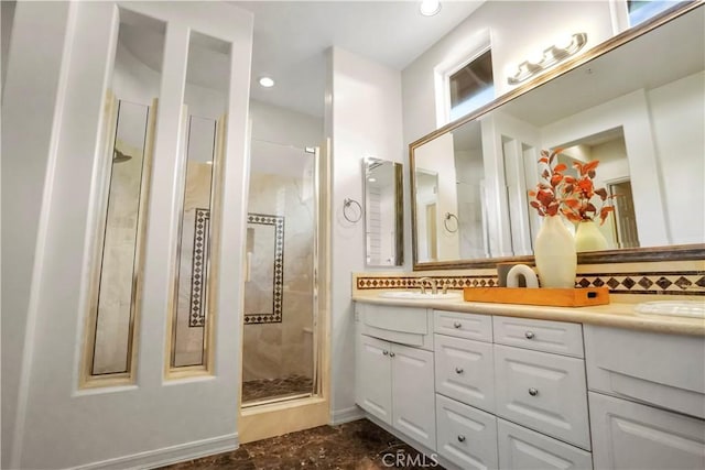 12165 Ojeda Ct, Tustin, CA 92782 - bathroom featuring a shower stall, double vanity, backsplash, and recessed lighting