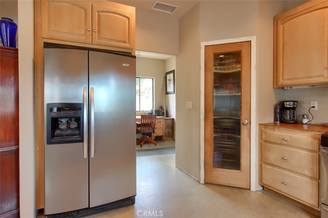 42625 Red Top Mountain Ct, Coarsegold, CA 93614 - kitchen with stainless steel fridge, concrete flooring, and light brown cabinetry