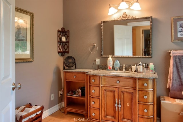42625 Red Top Mountain Ct, Coarsegold, CA 93614 - bathroom with vanity and wood finished floors
