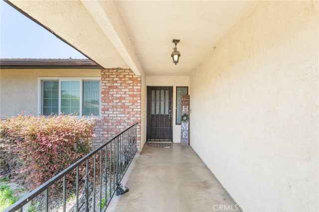 42159 Mayberry Ave, Hemet, CA 92544 - entrance to property with stucco siding and a balcony