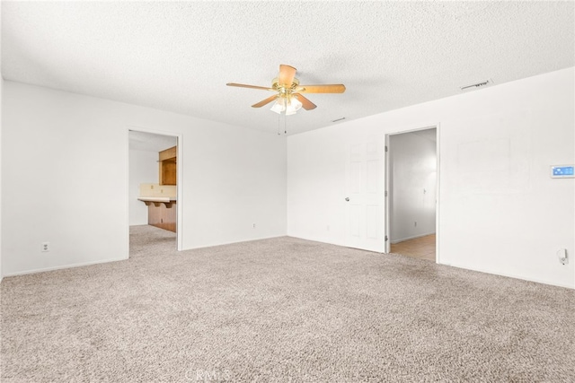 42159 Mayberry Ave, Hemet, CA 92544 - empty room featuring a ceiling fan, light carpet, and a textured ceiling