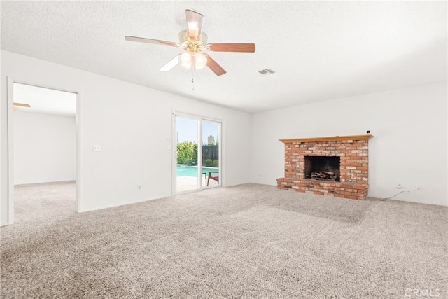 42159 Mayberry Ave, Hemet, CA 92544 - unfurnished living room with carpet, a ceiling fan, and a brick fireplace