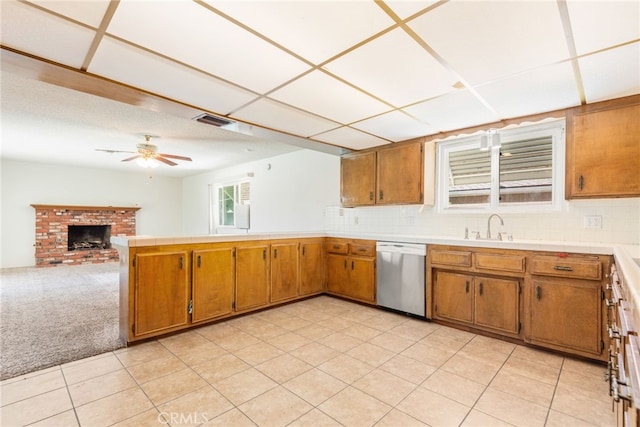 42159 Mayberry Ave, Hemet, CA 92544 - kitchen with dishwasher, a peninsula, and brown cabinetry