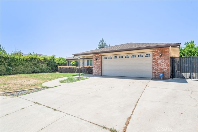 42159 Mayberry Ave, Hemet, CA 92544 - single story home featuring concrete driveway, an attached garage, and brick siding