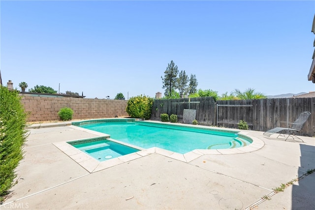 42159 Mayberry Ave, Hemet, CA 92544 - view of swimming pool with a patio area, a fenced backyard, and a pool with connected hot tub