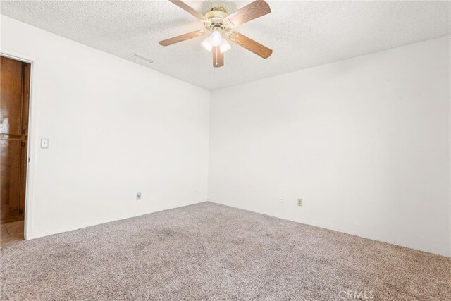 42159 Mayberry Ave, Hemet, CA 92544 - unfurnished room with carpet, ceiling fan, and a textured ceiling
