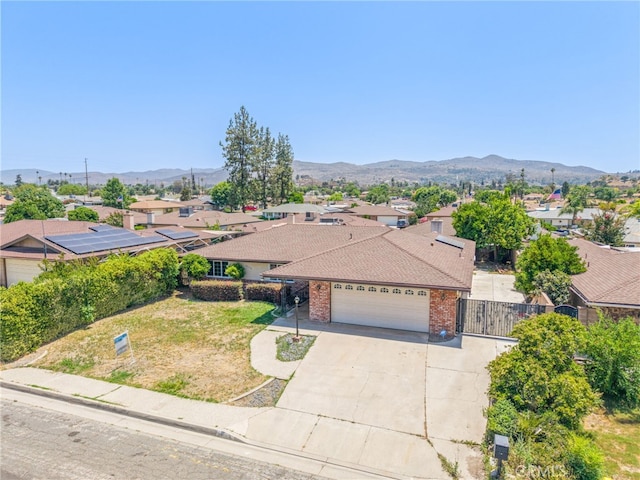 42159 Mayberry Ave, Hemet, CA 92544 - view of front of house with an attached garage, a residential view, concrete driveway, and a mountain view