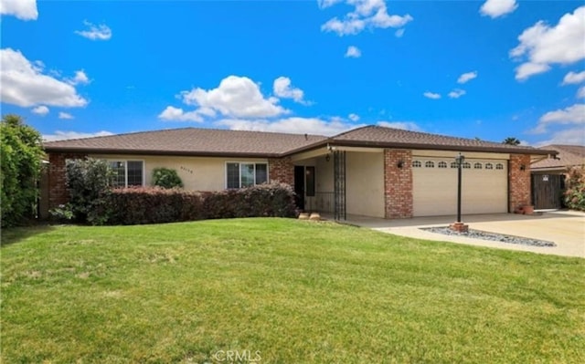 42159 Mayberry Ave, Hemet, CA 92544 - single story home with a garage, a front yard, driveway, and brick siding