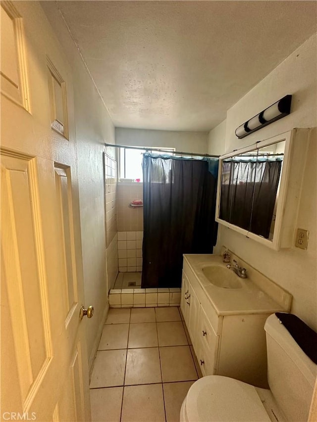 17406 Renault St, La Puente, CA 91744 - full bath featuring toilet, a stall shower, vanity, tile patterned flooring, and a textured ceiling