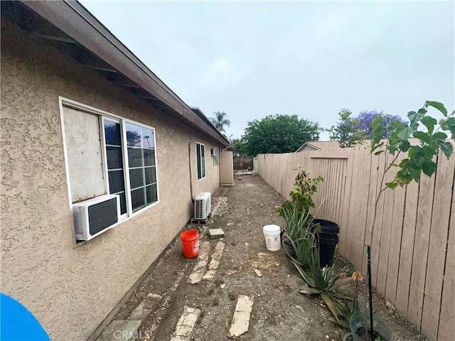 17406 Renault St, La Puente, CA 91744 - view of home's exterior with stucco siding, a fenced backyard, and ac unit