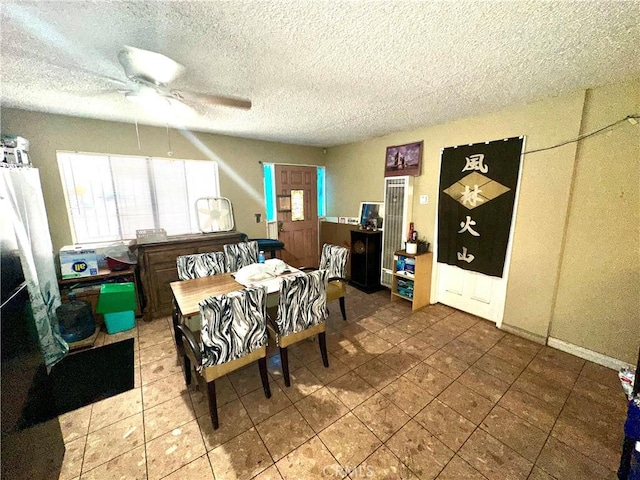 17406 Renault St, La Puente, CA 91744 - tiled dining room featuring a ceiling fan and a textured ceiling