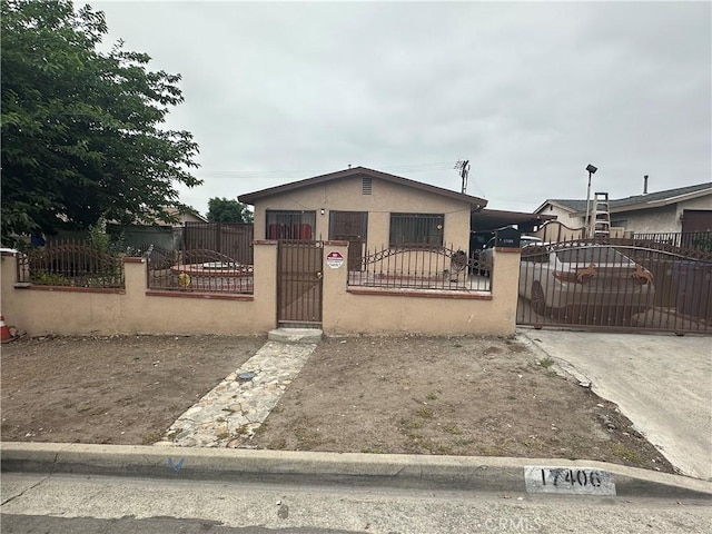 17406 Renault St, La Puente, CA 91744 - bungalow featuring stucco siding, a fenced front yard, and a gate