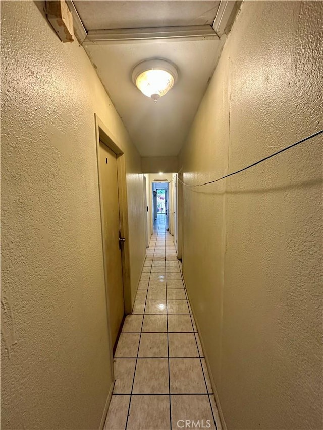 17406 Renault St, La Puente, CA 91744 - hallway with a textured wall and light tile patterned floors