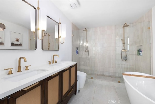 3550 Goldenrod Cir, Seal Beach, CA 90740 - full bathroom featuring a stall shower, a freestanding bath, double vanity, toilet, and tile patterned flooring