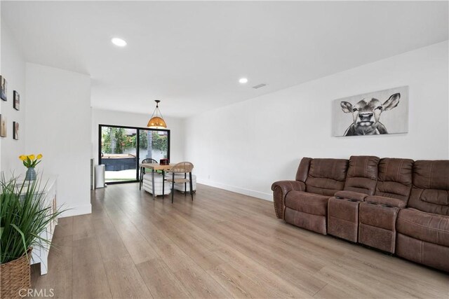 3550 Goldenrod Cir, Seal Beach, CA 90740 - living area with light wood-style flooring, recessed lighting, and baseboards