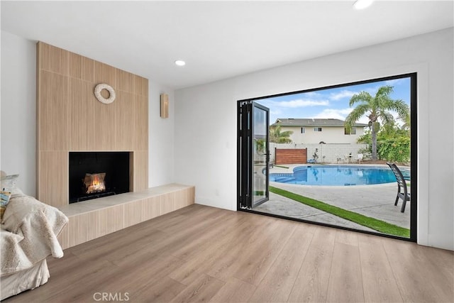 3550 Goldenrod Cir, Seal Beach, CA 90740 - unfurnished living room with wood finished floors, a large fireplace, and recessed lighting