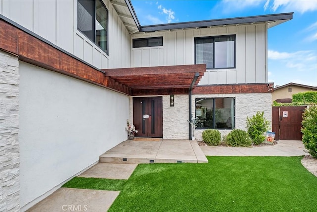 3550 Goldenrod Cir, Seal Beach, CA 90740 - property entrance featuring board and batten siding and stone siding